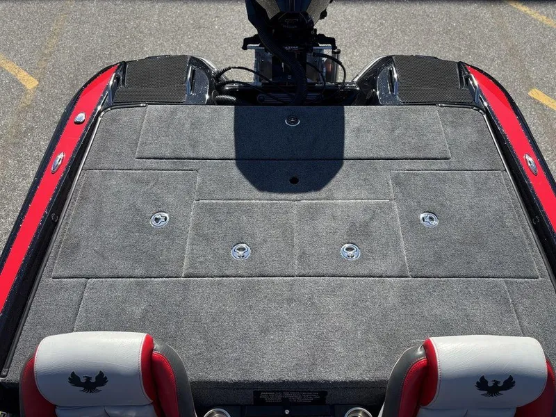 Slide: The Image of 2025 Phoenix 721 ZXL boat deck with gray carpet and red accents. - 15