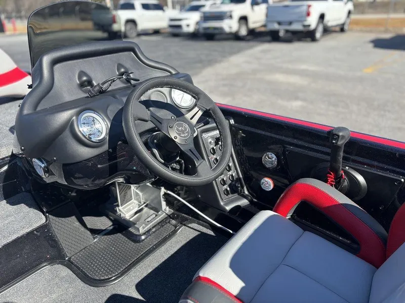 Slide: The Image of 2025 Phoenix 721 ZXL boat cockpit with steering wheel and control panel. - 9
