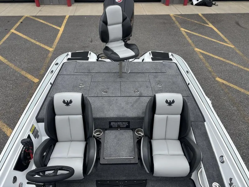 Slide: The Image of 2025 Phoenix 721 ZXL boat interior with three seats and gray carpeting. - 10