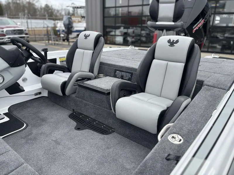 Slide: The Image of 2025 Phoenix 721 ZXL boat interior with dual gray seats and steering console. - 11