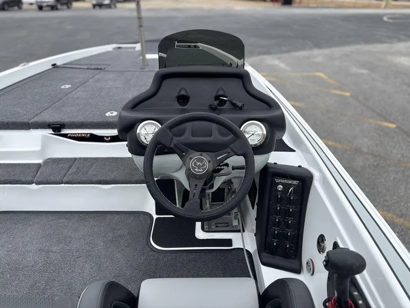 Slide: The Image of 2025 Phoenix 721 ZXL boat cockpit with steering wheel and control panel. - 6