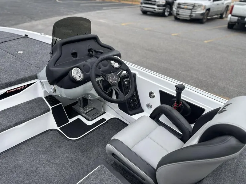 Slide: The Image of 2025 Phoenix 721 ZXL boat cockpit with steering wheel and seating. - 9