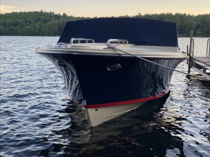 Slide: The Image of 2017 Rossiter 20 Coastal Cruiser docked on a serene lake. - 1