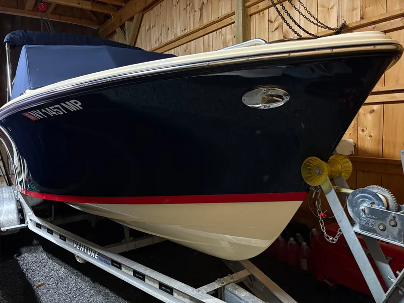 Slide: The Image of 2017 Rossiter 20 Coastal Cruiser boat on trailer in wooden garage. - 14