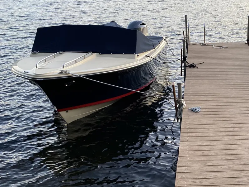 Slide: The Image of 2017 Rossiter 20 Coastal Cruiser docked on calm water. - 2