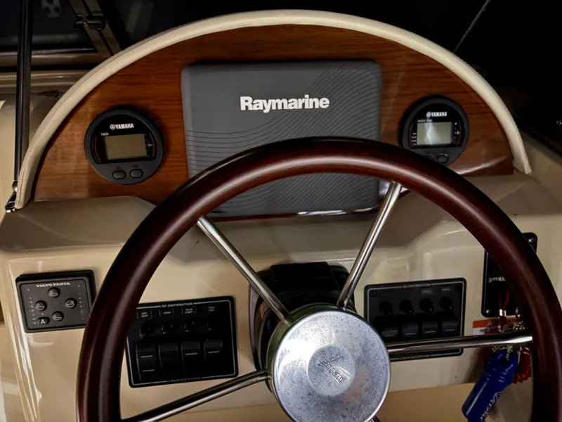 Slide: The Image of Steering wheel and dashboard of 2017 Rossiter 20 Coastal Cruiser with Raymarine electronics. - 5