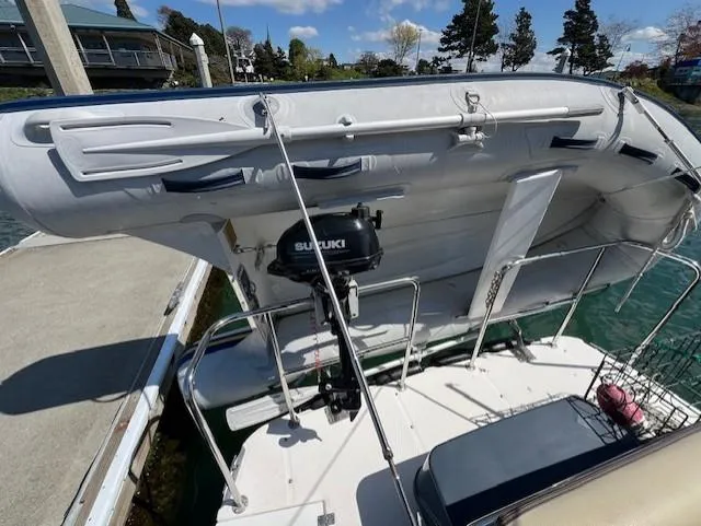 Slide: The Image of 2020 Ranger Tugs R-31 CB with Suzuki outboard motor, docked at marina. - 26