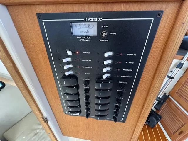 Slide: The Image of Electrical panel of 2020 Ranger Tugs R-31 CB boat, featuring switches and voltage meter. - 31