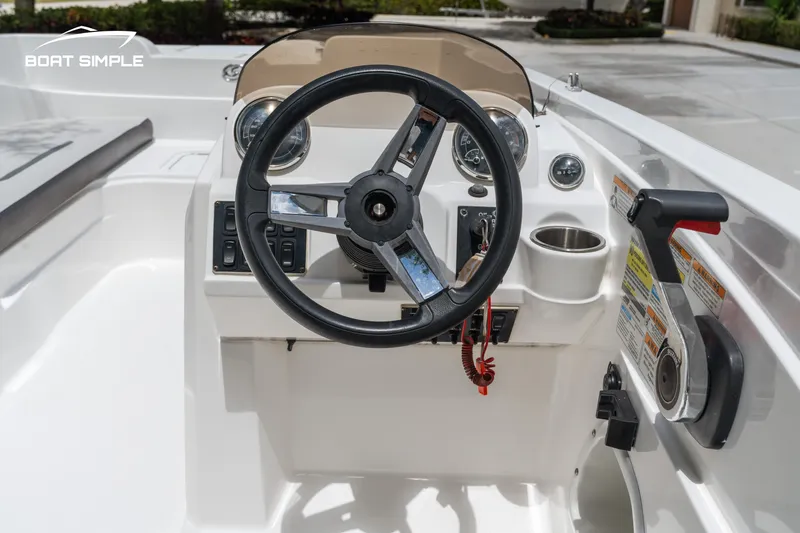 Slide: The Image of 2021 Hurricane SS 205 boat dashboard with steering wheel and controls. - 10