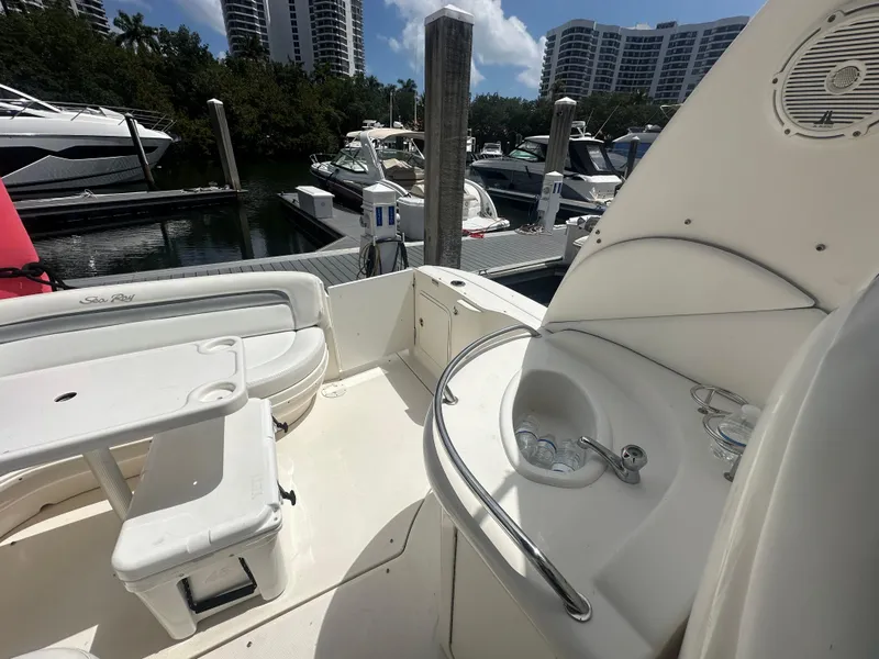 Slide: The Image of 2004 Sea Ray 340 Sundancer yacht interior with seating and sink at marina. - 17