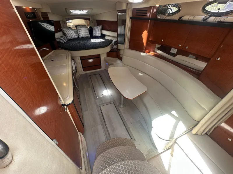 Slide: The Image of Luxurious interior of a 2004 Sea Ray 340 Sundancer yacht with elegant wood finishes. - 32