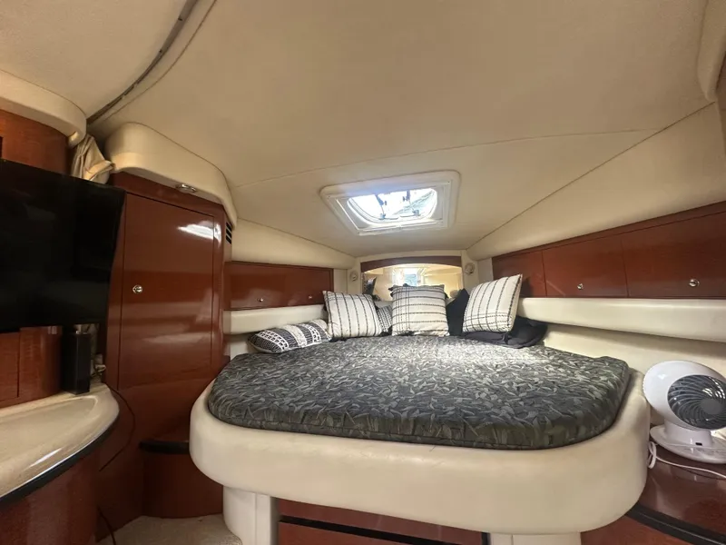 Slide: The Image of Interior cabin of 2004 Sea Ray 340 Sundancer with bed and pillows. - 42