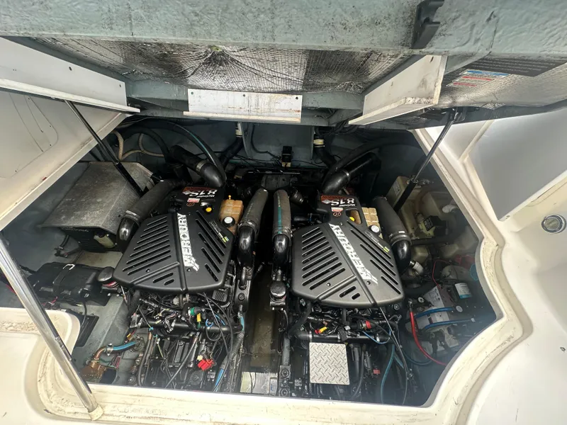 Slide: The Image of Engine compartment of a 2004 Sea Ray 340 Sundancer with twin MerCruiser engines. - 46