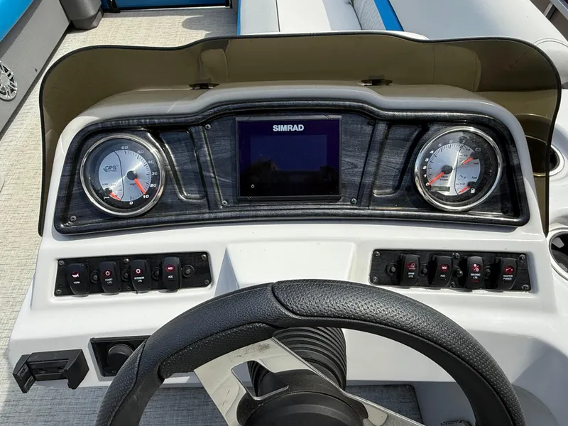 Slide: The Image of Dashboard of 2021 Godfrey SWEETWATER 2286 MT boat with gauges and controls. - 12