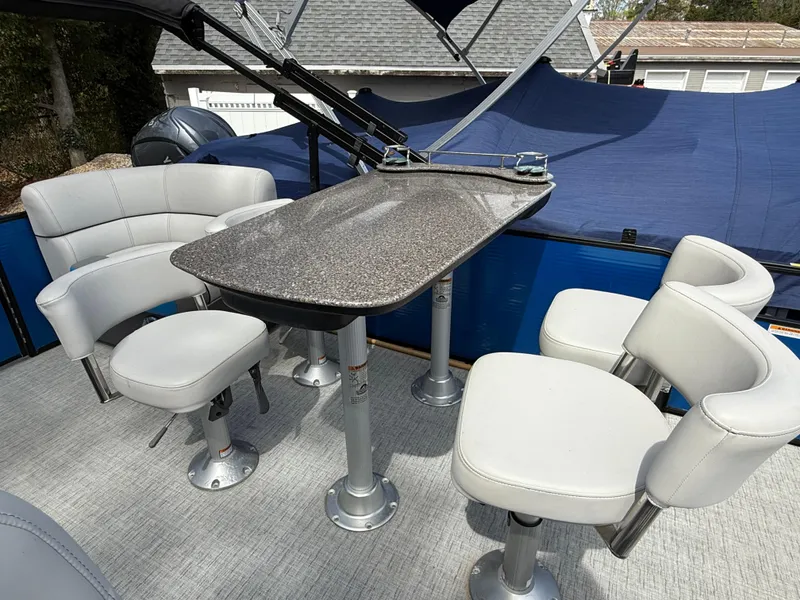 Slide: The Image of Pontoon boat interior with table and swivel chairs, Godfrey SWEETWATER 2286 MT, 2021 model. - 13