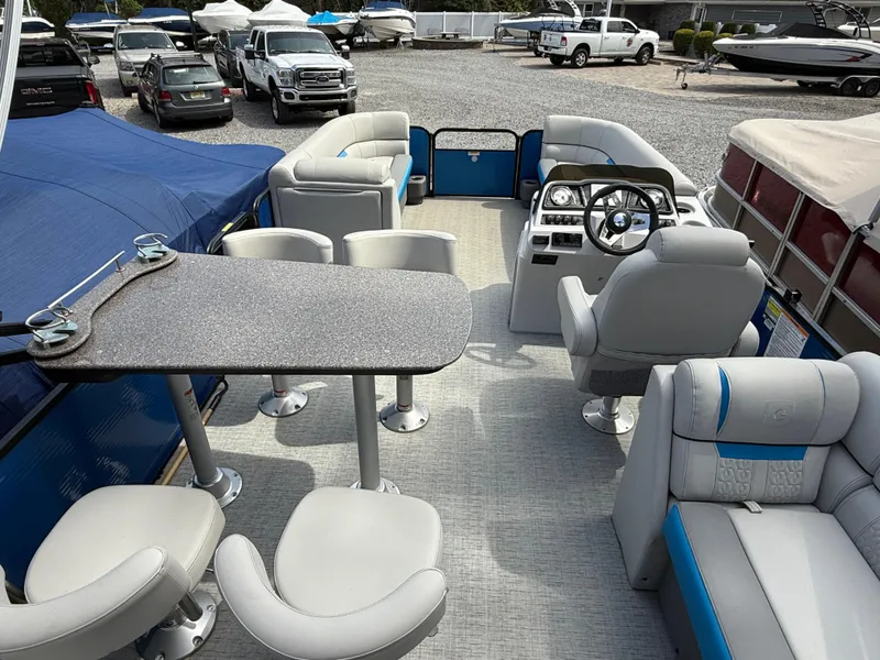 Slide: The Image of 2021 Godfrey SWEETWATER 2286 MT pontoon boat interior with seating and steering console. - 16