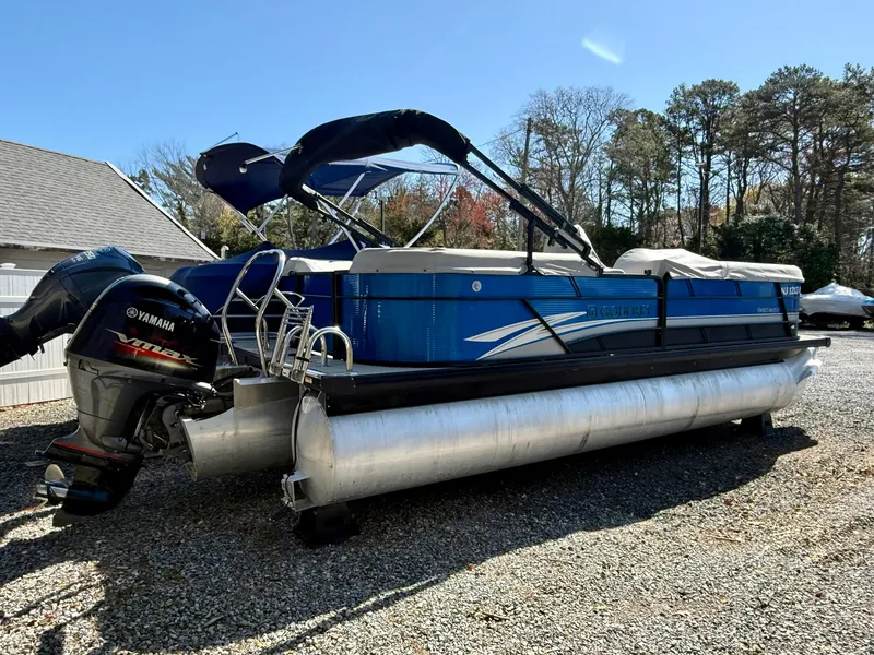 Slide: The Image of 2021 Godfrey SWEETWATER 2286 MT pontoon boat with Yamaha engine, parked outdoors. - 3