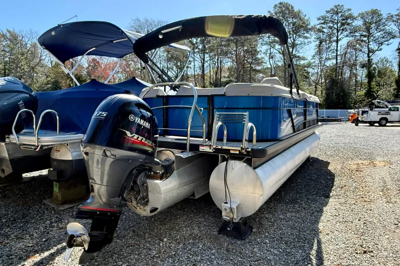 Slide: The Image of 2021 Godfrey SWEETWATER 2286 MT pontoon boat with Yamaha 175 engine, parked outdoors. - 4