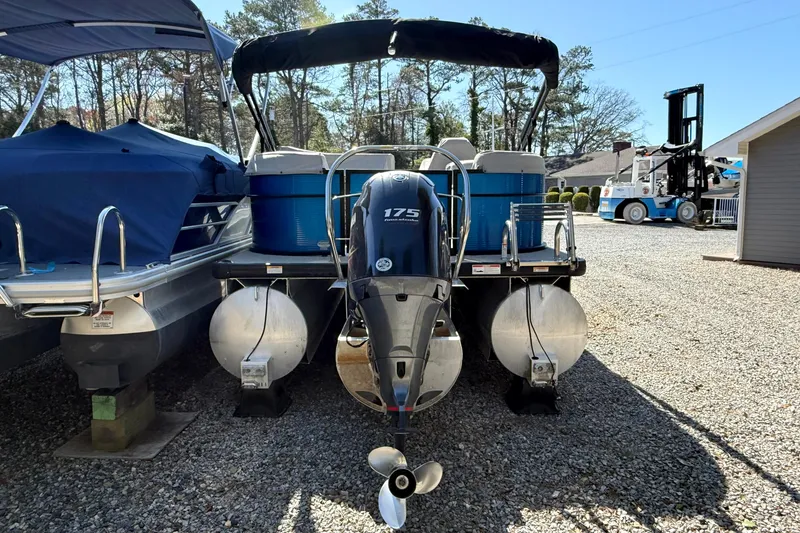 Slide: The Image of 2021 Godfrey SWEETWATER 2286 MT pontoon boat with 175 HP engine, parked outdoors. - 5