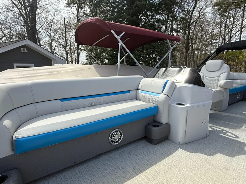 Slide: The Image of 2021 Godfrey SWEETWATER 2286 MT pontoon boat with blue and gray seating, red canopy. - 7