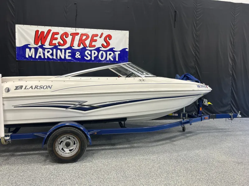 Slide: The Image of 2007 Larson 180 Sport boat on trailer at Westre's Marine & Sport showroom. - 0