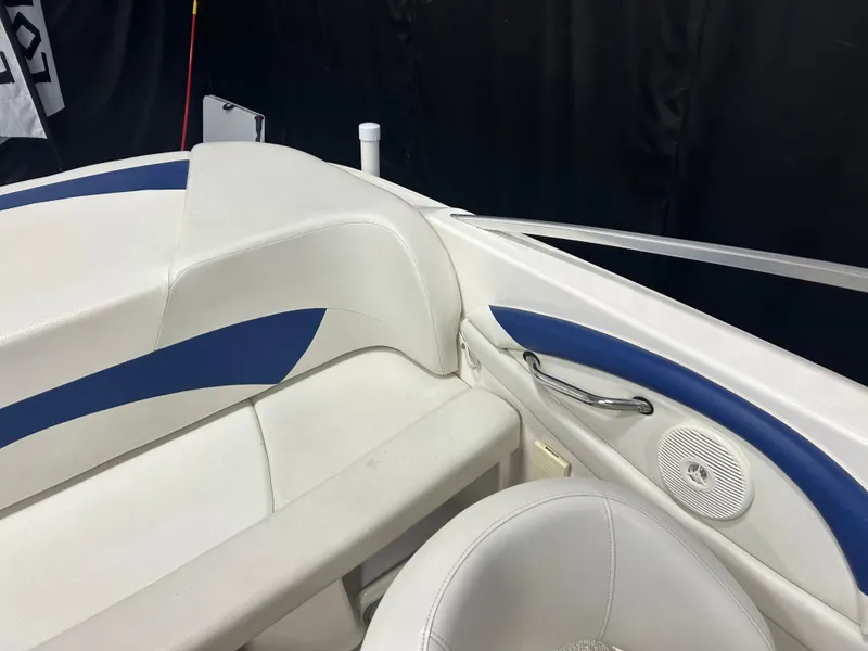 Slide: The Image of Interior of a 2007 Larson 180 Sport boat with white and blue seating. - 13