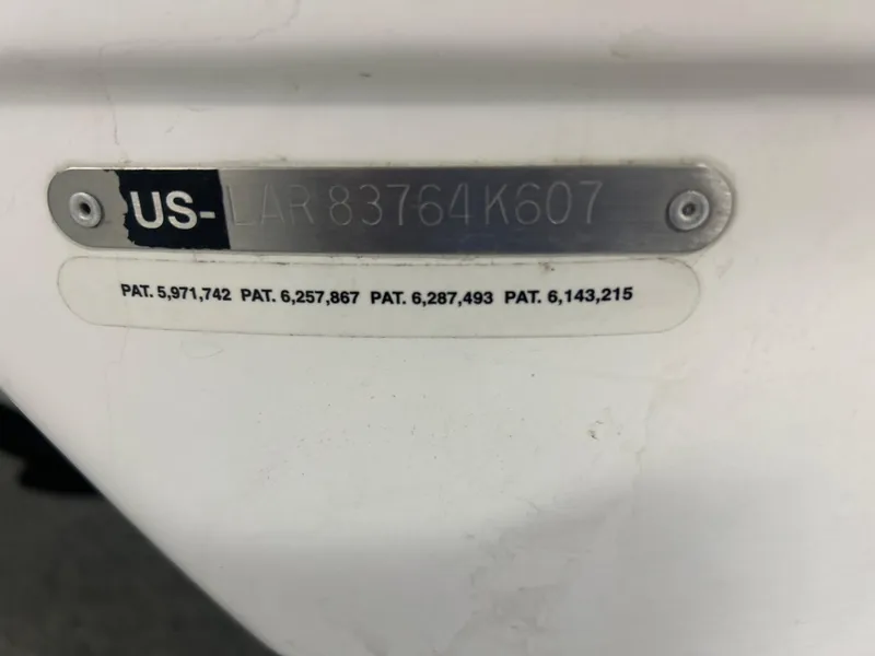 Slide: The Image of 2007 Larson 180 Sport boat identification plate with patent numbers and serial code. - 16