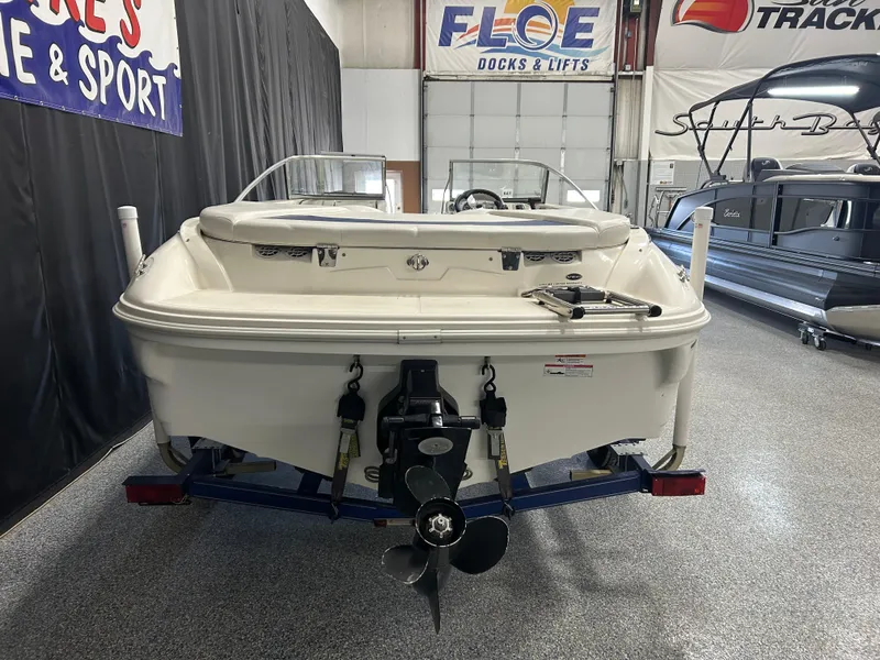 Slide: The Image of 2007 Larson 180 Sport boat in showroom, rear view with propeller and trailer. - 3