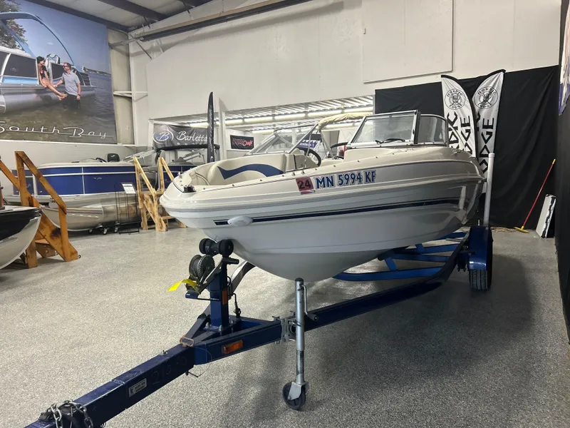Slide: The Image of 2007 Larson 180 Sport boat on trailer in showroom setting. - 5