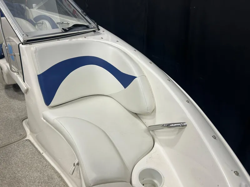 Slide: The Image of 2007 Larson 180 Sport boat interior with white and blue seating. - 8