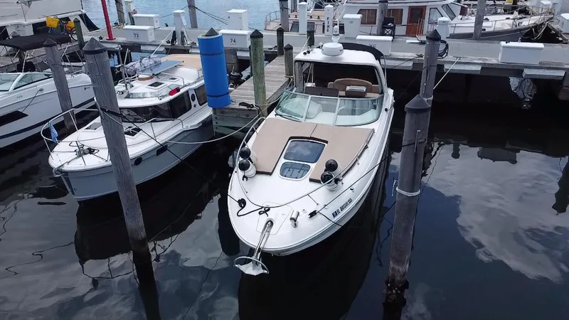 Slide: The Image of 2012 Sea Ray 310 Sundancer docked at marina, aerial view. - 7