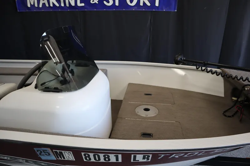 Slide: The Image of 2013 MirroCraft 1416 Troller boat interior with steering console and deck. - 10