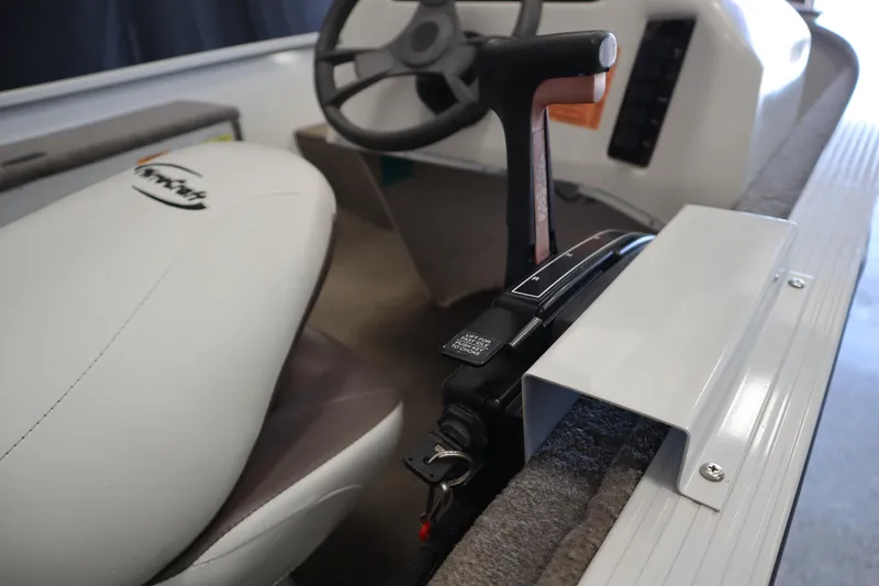 Slide: The Image of 2013 MirroCraft 1416 Troller boat interior with steering wheel and control panel. - 14