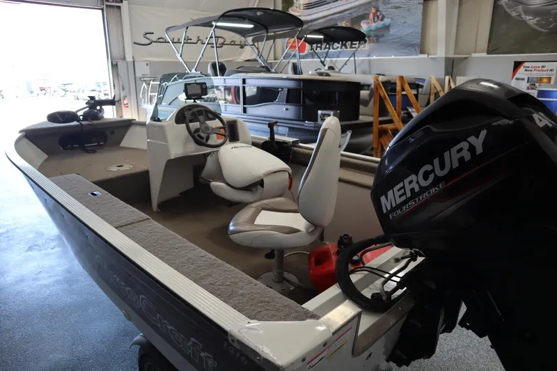 Slide: The Image of 2013 MirroCraft 1416 Troller boat with Mercury engine in showroom. - 18