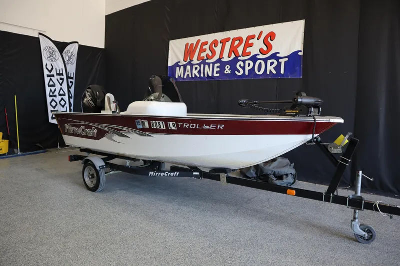 Slide: The Image of 2013 MirroCraft 1416 Troller boat on trailer at Westre's Marine & Sport showroom. - 2