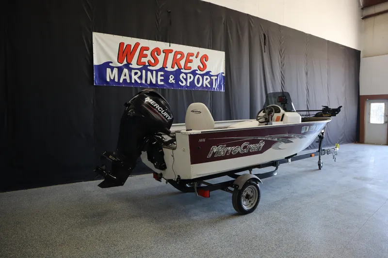 Slide: The Image of 2013 MirroCraft 1416 Troller boat displayed at Westre's Marine & Sport showroom. - 4