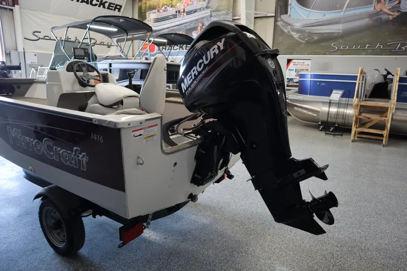 Slide: The Image of 2013 MirroCraft 1416 Troller boat with Mercury outboard motor in showroom. - 6