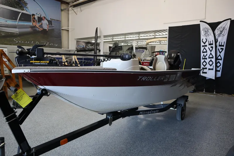 Slide: The Image of 2013 MirroCraft 1416 Troller boat on display in showroom. - 7