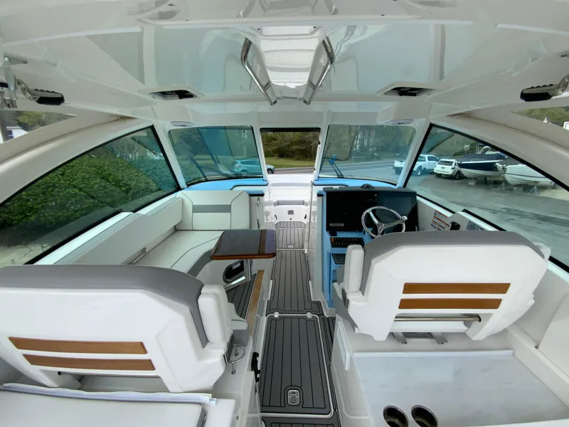 Slide: The Image of 2023 Pursuit DC 326 Dual Console interior with modern seating and sleek design. - 16