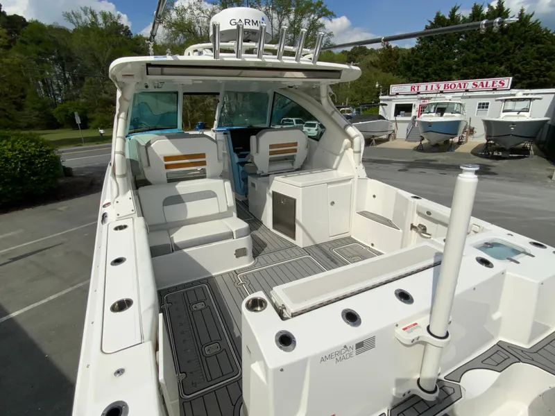 Slide: The Image of 2023 Pursuit DC 326 Dual Console boat with spacious deck and seating area. - 9
