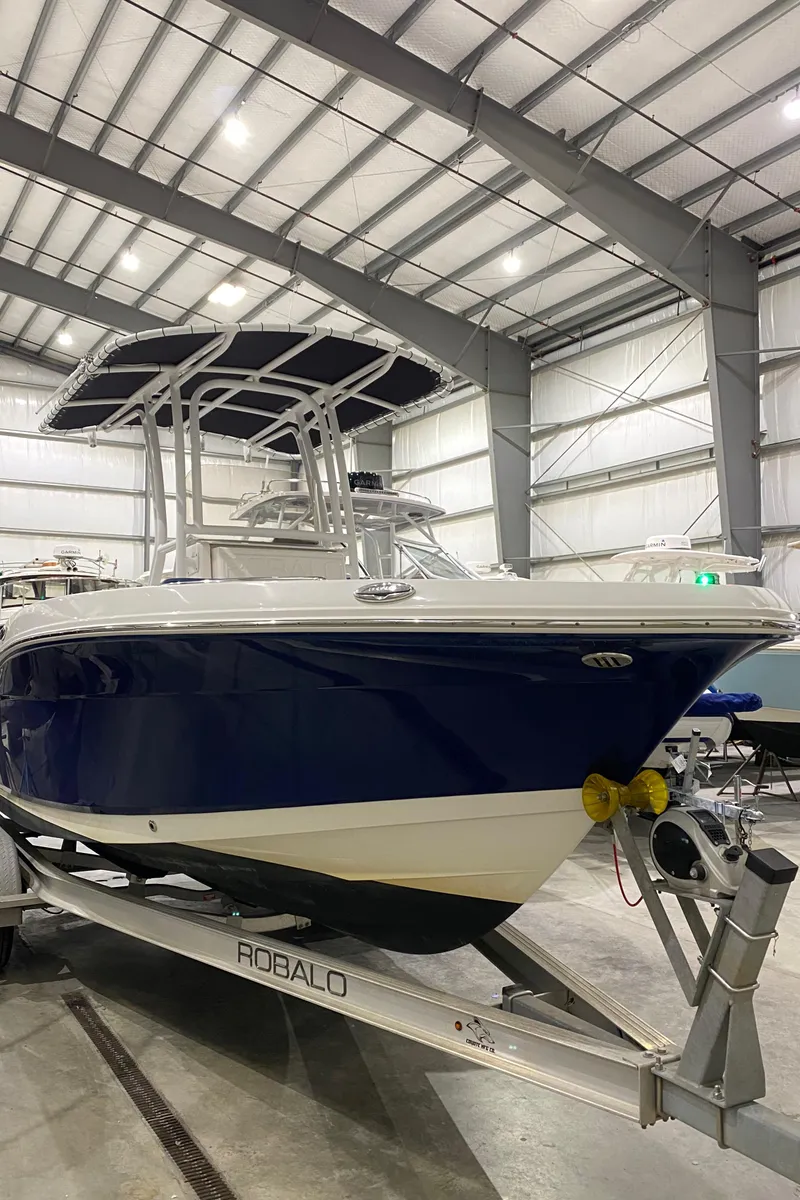 Slide: The Image of 2022 Robalo R200 Center Console boat in indoor storage facility. - 3
