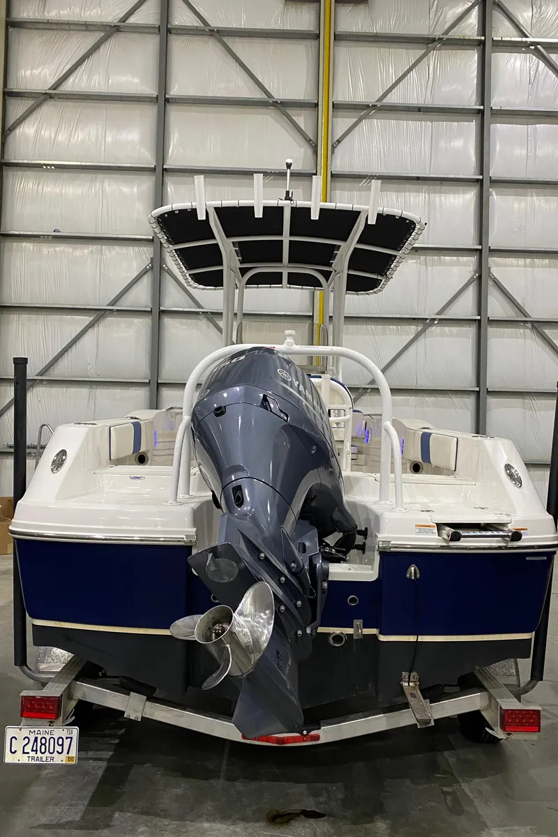 Slide: The Image of 2022 Robalo R200 Center Console boat in storage, rear view with outboard motor. - 5