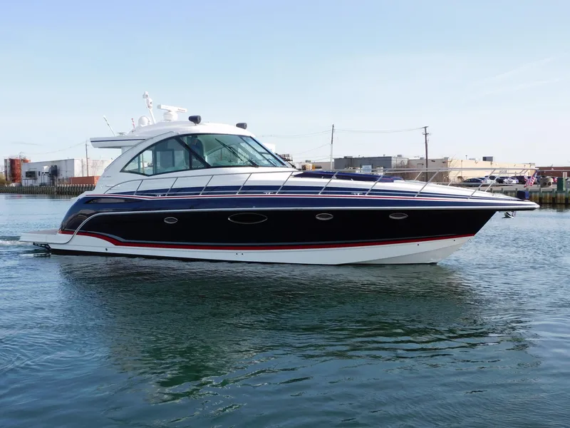 Slide: The Image of 2015 Formula YACHT 45 cruising on calm waters near industrial docks. - 11