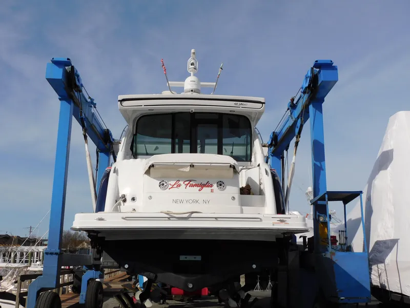 Slide: The Image of 2015 Formula YACHT 45 on lift, rear view, New York marina setting. - 16