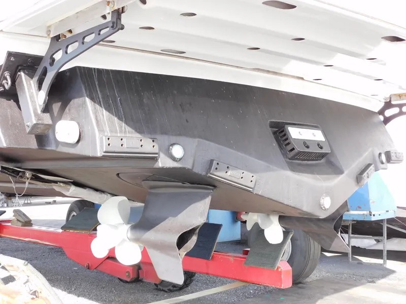 Slide: The Image of Underneath view of a 2015 Formula YACHT 45 on a trailer, showing propellers and hull details. - 27