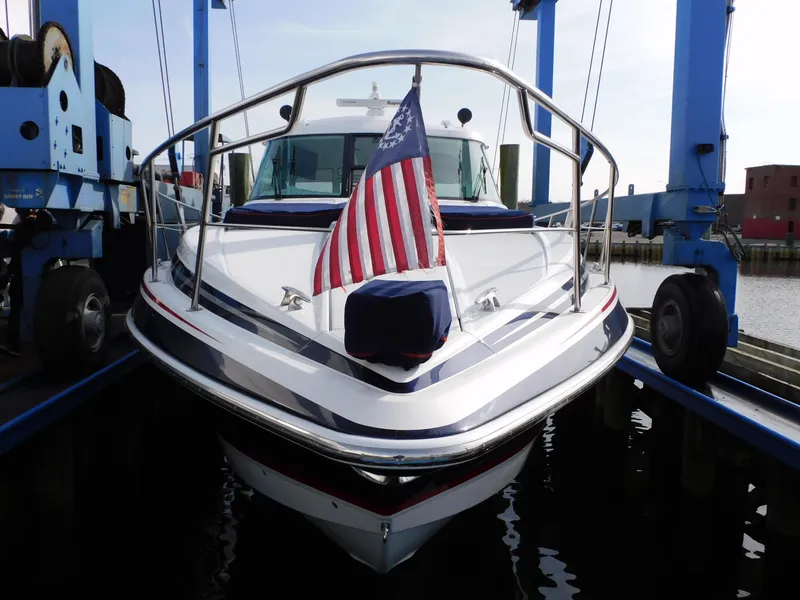 Slide: The Image of 2015 Formula YACHT 45 with American flag, docked in a marina. - 33