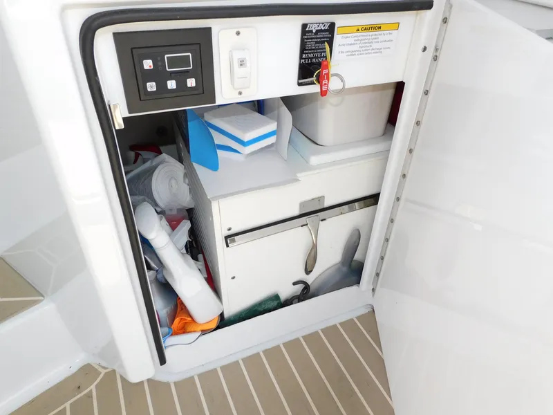 Slide: The Image of Storage compartment on a 2015 Formula YACHT 45, containing cleaning supplies and equipment. - 47