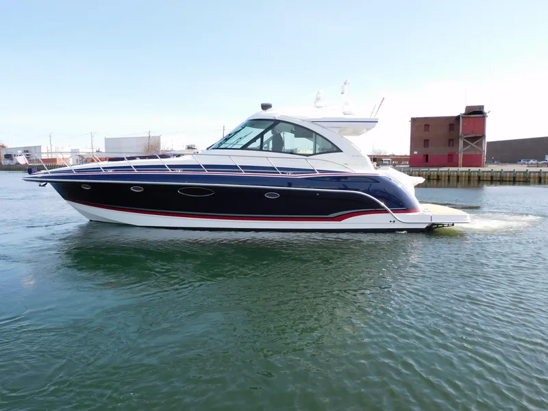 Slide: The Image of 2015 Formula YACHT 45 cruising on calm waters near industrial buildings. - 6