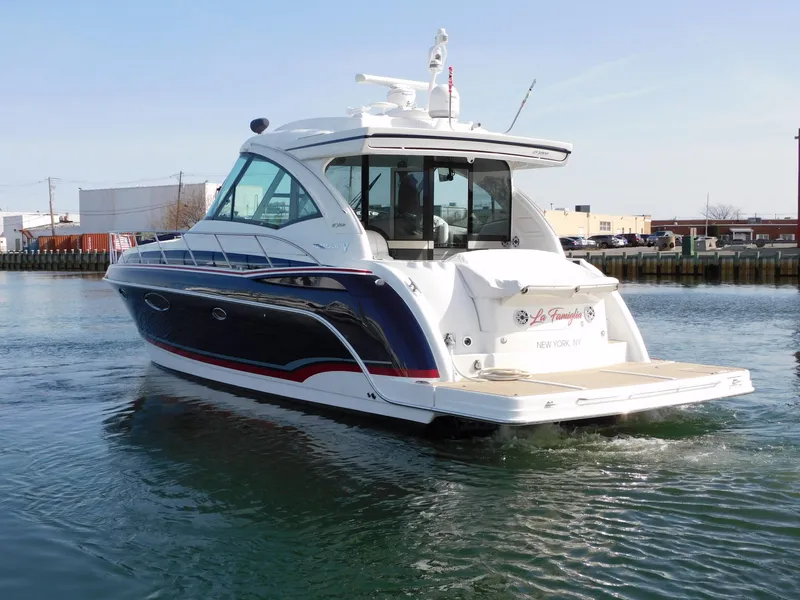 Slide: The Image of Luxury 2015 Formula YACHT 45 cruising in a calm harbor setting. - 7