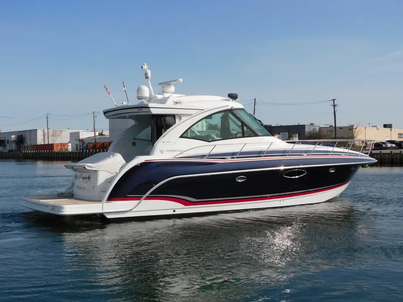 Slide: The Image of 2015 Formula YACHT 45 cruising on calm waters, showcasing sleek design and modern features. - 9